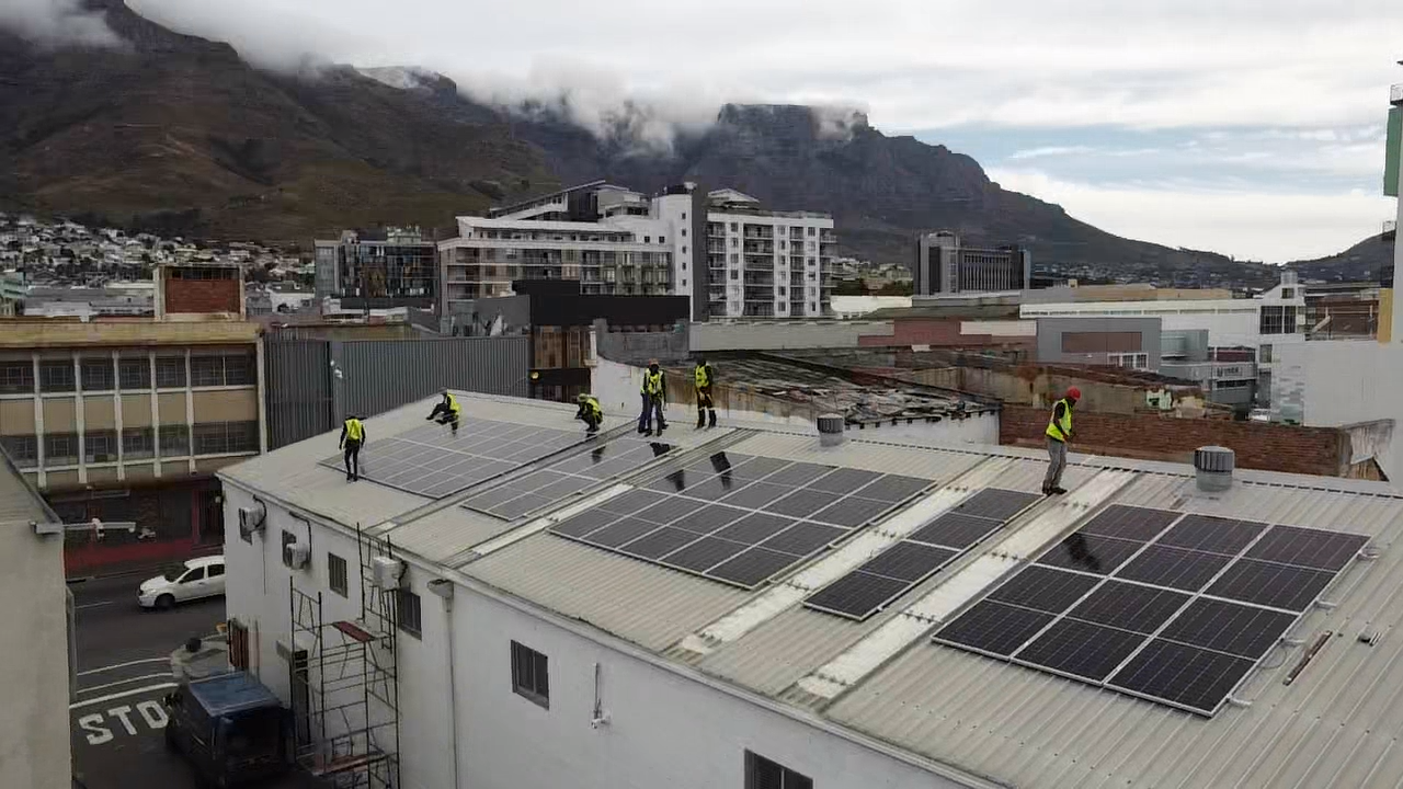 Cape Town Solar team installing solar panels on a commercial rooftop